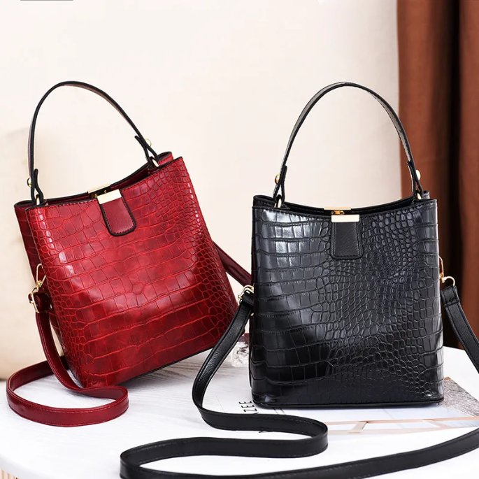 Sienna Croc Pattern Bucket Bag (1) Sienna croc pattern bucket bags in red and black with top handles, detachable shoulder straps and gold tone hardware