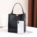 Sienna Croc Pattern Bucket Bag-black (3) Black Sienna croc pattern bucket bag shown with smartphone for size comparison