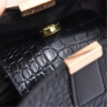 Sienna Croc Pattern Bucket Bag-black (8) Close-up of black Sienna croc pattern bucket bag magnetic clasp and croc textured exterior