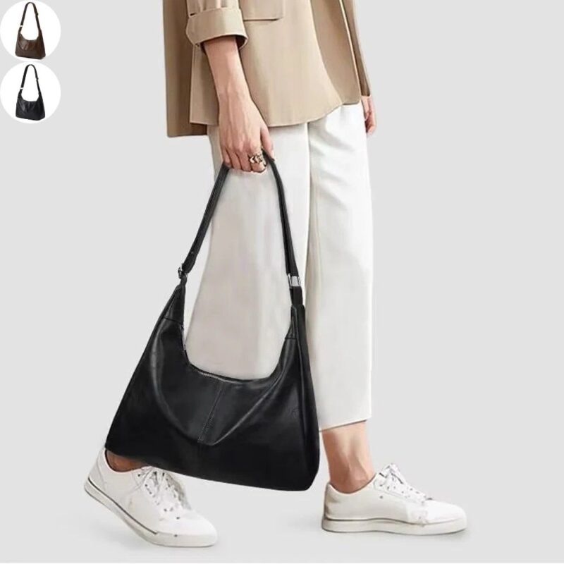 Sutton Hobo Shoulder Bag Woman carrying black Sutton Hobo Shoulder Bag with adjustable strap, slouchy leather-look design and casual outfit, with black and brown color options