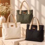 Tegan Large Canvas Tote Bag Tegan Large Canvas Tote Bag collection in black, green and white with beige shoulder straps, spacious design and front pockets
